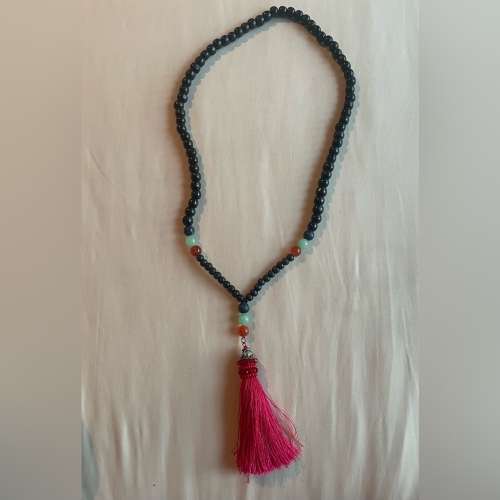 Elegant Beaded Necklace with Pink Tassel